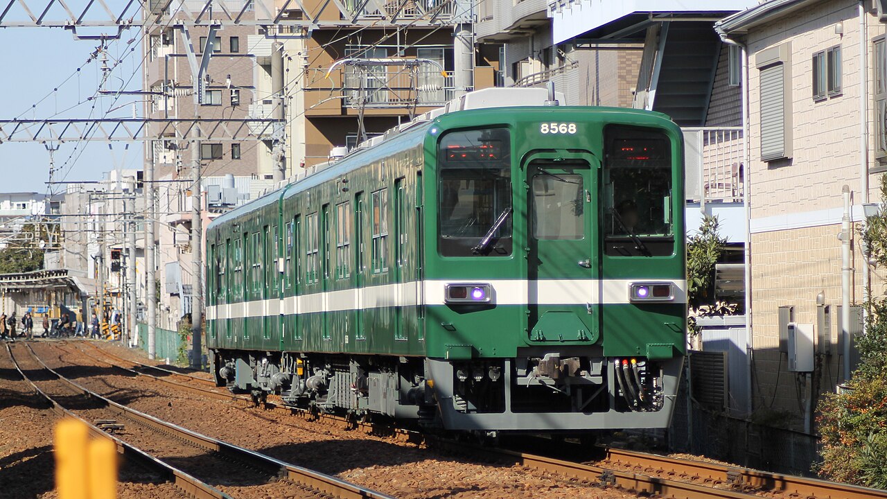 Tōbu 8000 series 2-car EMU set 8568 in special commemorative green and white livery between Higashi-