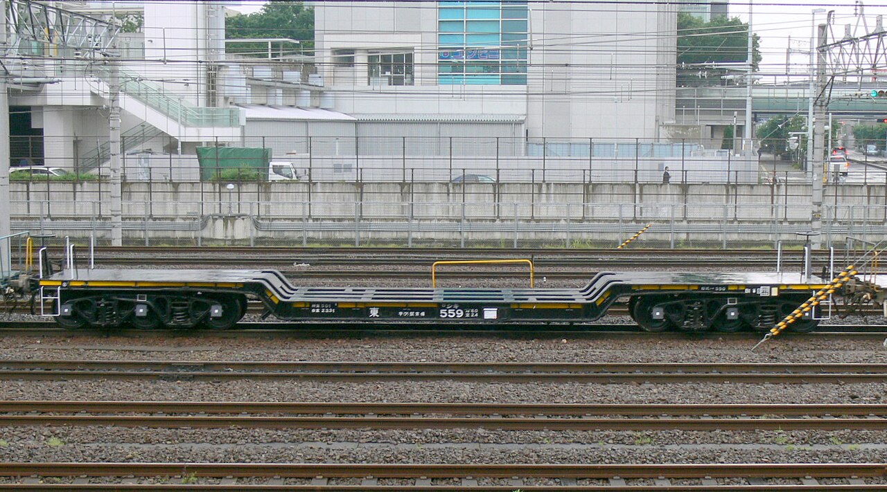 JR freight Shiki 550 Schnabel car Shiki 559 next to Saitama Shintoshin Station in Japan